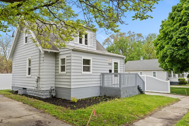 2069 Michael Ave SW, Wyoming, MI 49509 - view of front of house featuring a wooden deck and roof with shingles