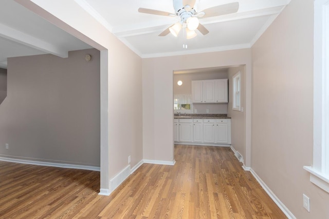 2069 Michael Ave SW, Wyoming, MI 49509 - hall with light wood finished floors, baseboards, crown molding, and a sink