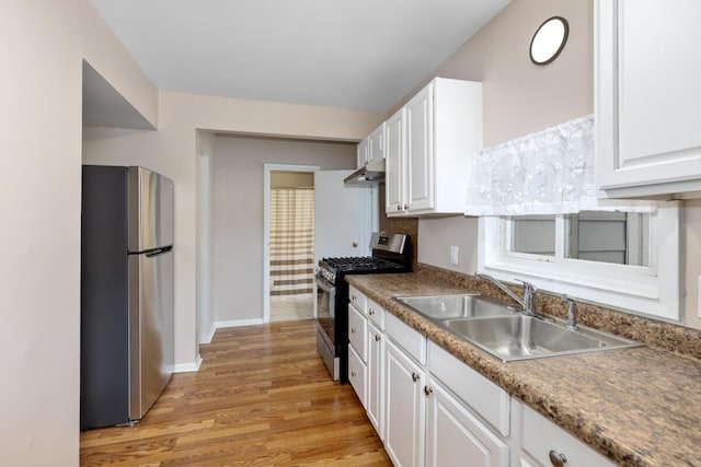 2069 Michael Ave SW, Wyoming, MI 49509 - kitchen featuring stainless steel appliances, a sink, and white cabinets