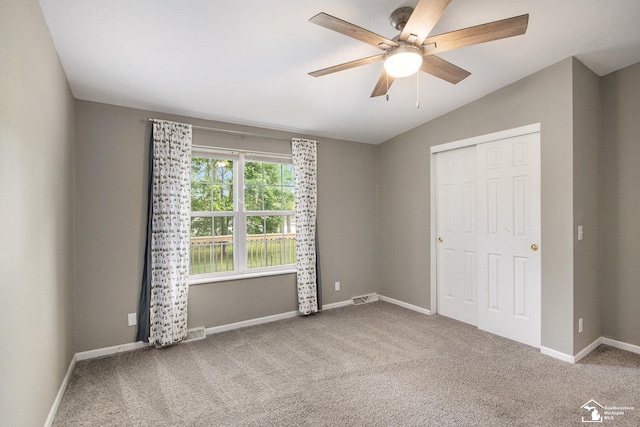 635 Pokey Dr, Hastings, MI 49058 - unfurnished bedroom featuring lofted ceiling, carpet floors, a closet, baseboards, and ceiling fan