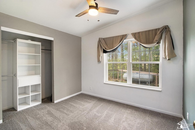 635 Pokey Dr, Hastings, MI 49058 - unfurnished bedroom featuring carpet flooring, baseboards, a ceiling fan, vaulted ceiling, and a closet