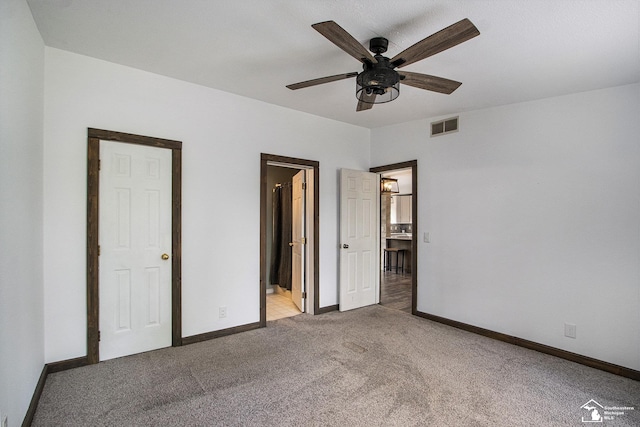 635 Pokey Dr, Hastings, MI 49058 - unfurnished bedroom with carpet floors, baseboards, and ensuite bath