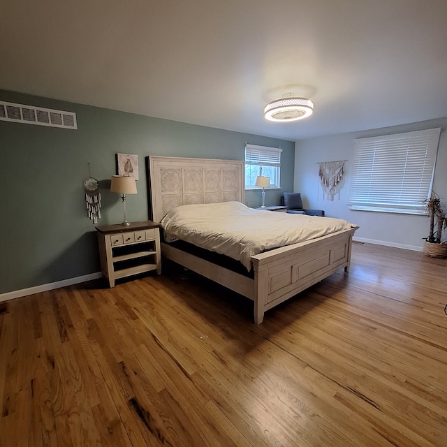 21140 Winchester St, Southfield, MI 48076 - bedroom featuring wood finished floors and baseboards