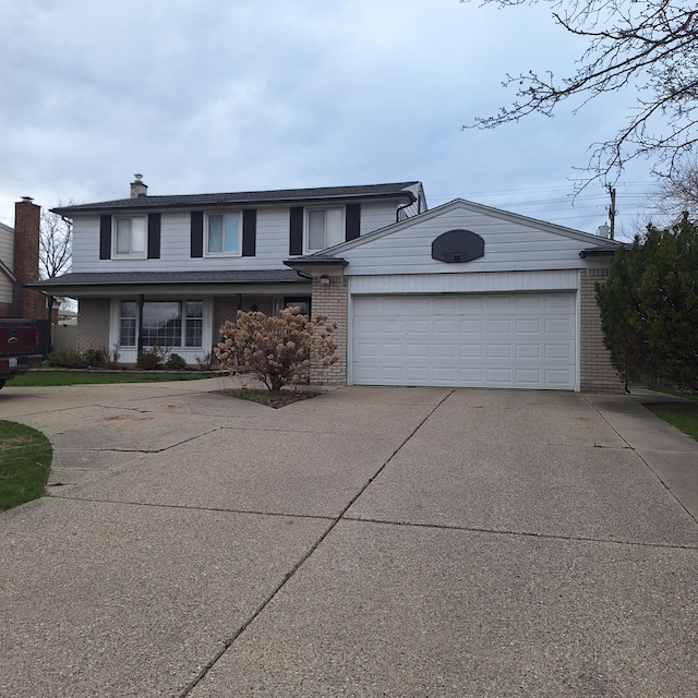 21140 Winchester St, Southfield, MI 48076 - traditional-style house with brick siding, concrete driveway, a garage, and a chimney