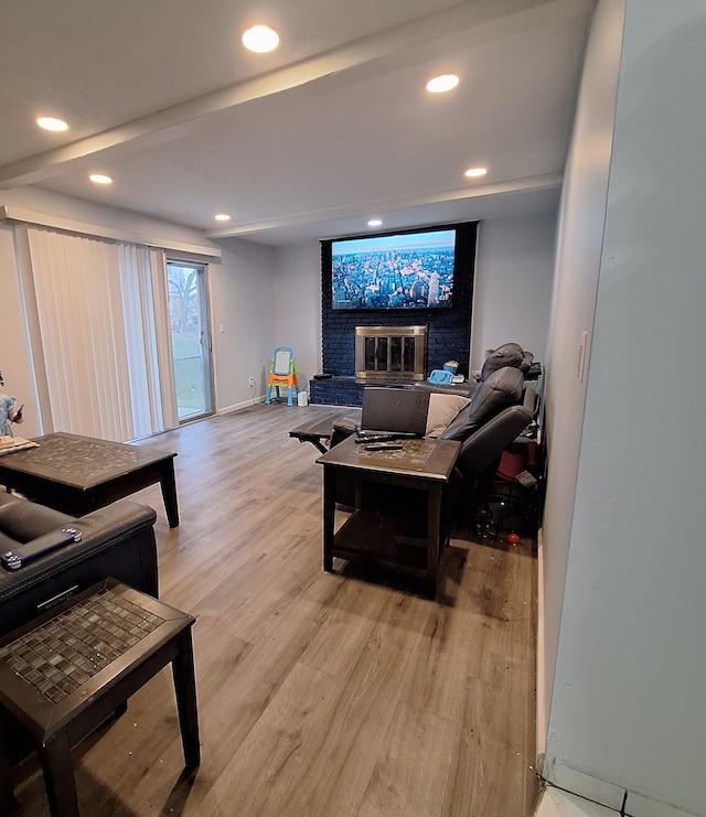 21140 Winchester St, Southfield, MI 48076 - living area with light wood-type flooring, a brick fireplace, recessed lighting, and baseboards
