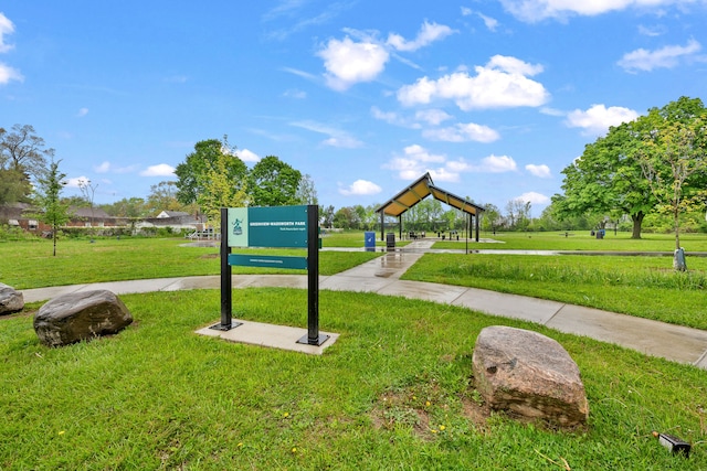 view of property's community with a yard
