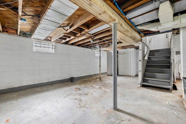 basement featuring stairs