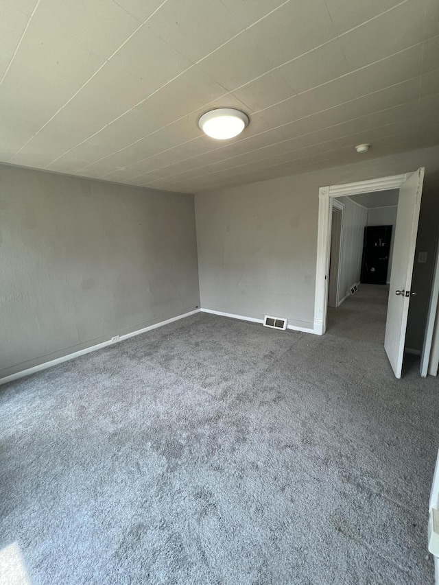 939 Baraga St NE, Grand Rapids, MI 49503 - spare room with carpet flooring and baseboards