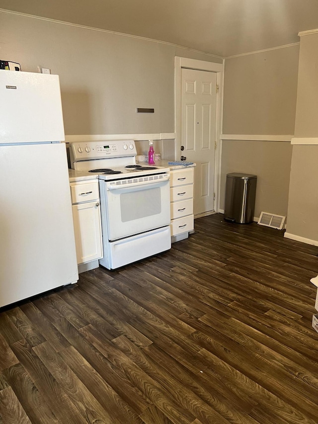 939 Baraga St NE, Grand Rapids, MI 49503 - kitchen with white appliances, white cabinetry, dark wood-type flooring, light countertops, and crown molding