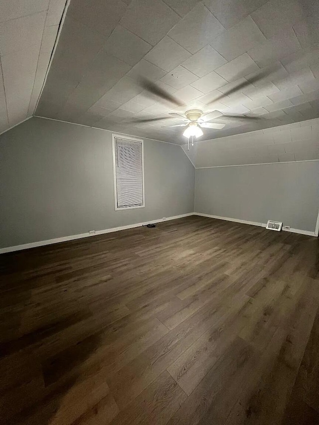 939 Baraga St NE, Grand Rapids, MI 49503 - additional living space featuring a ceiling fan, lofted ceiling, dark wood finished floors, and baseboards