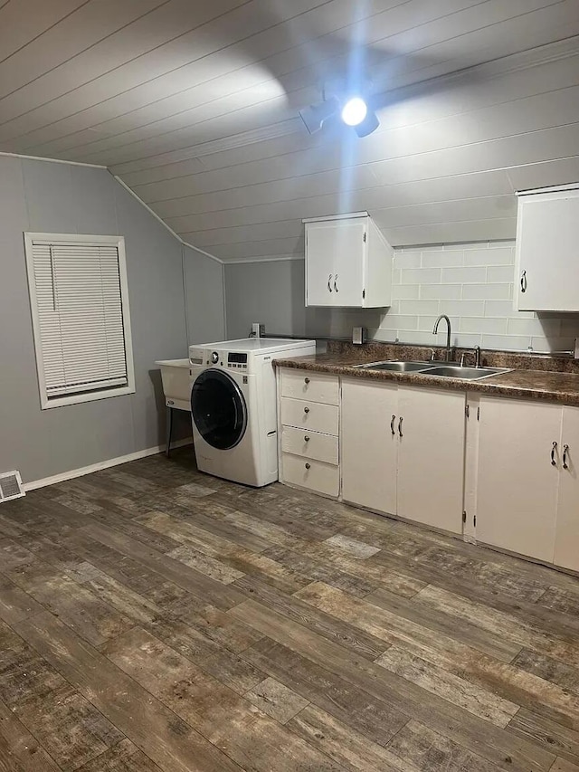 939 Baraga St NE, Grand Rapids, MI 49503 - laundry room with cabinet space, dark wood-type flooring, washer / dryer, baseboards, and wood ceiling