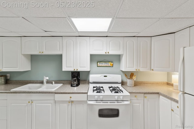 13953 Grandpoint Dr, Cement City, MI 49233 - kitchen with white appliances, a sink, a drop ceiling, and white cabinets