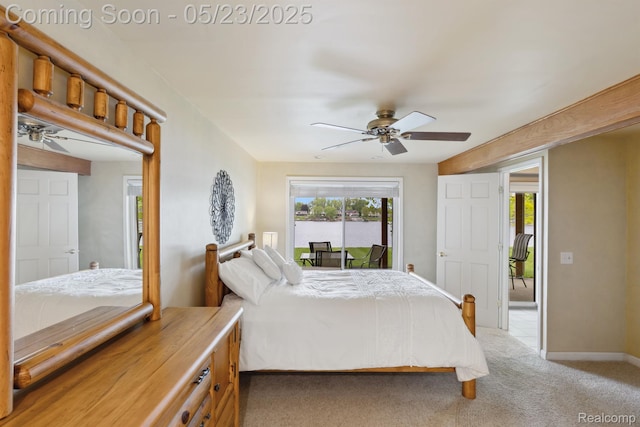 13953 Grandpoint Dr, Cement City, MI 49233 - bedroom featuring access to exterior, light colored carpet, a ceiling fan, and baseboards