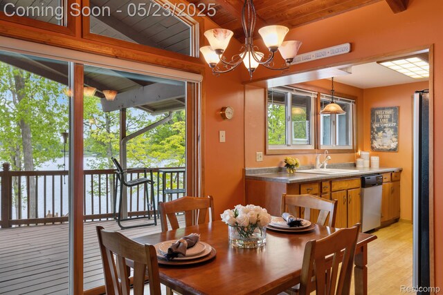 13953 Grandpoint Dr, Cement City, MI 49233 - dining space with wooden ceiling with exposed beams, a chandelier, and light wood-type flooring