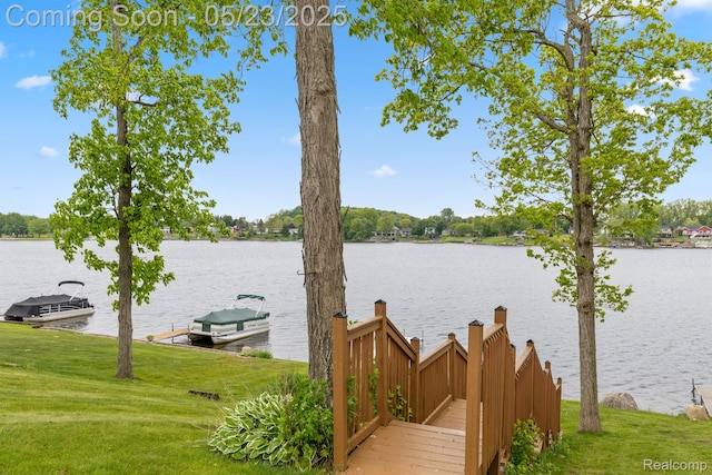 13953 Grandpoint Dr, Cement City, MI 49233 - dock area featuring a water view and a lawn