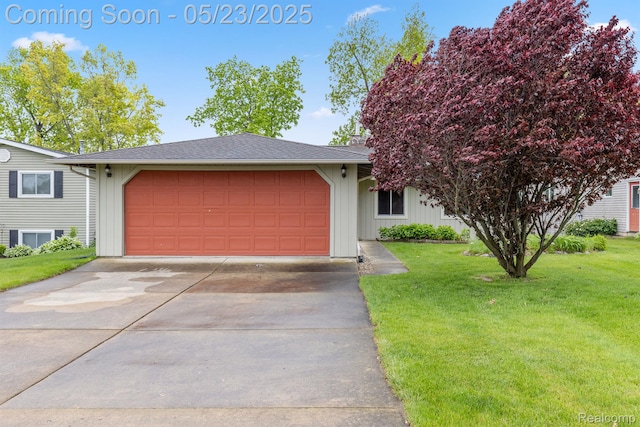 13953 Grandpoint Dr, Cement City, MI 49233 - view of front of home with a front lawn, an attached garage, and driveway