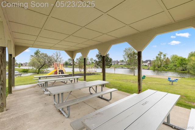 13953 Grandpoint Dr, Cement City, MI 49233 - view of patio with a playground and a water view