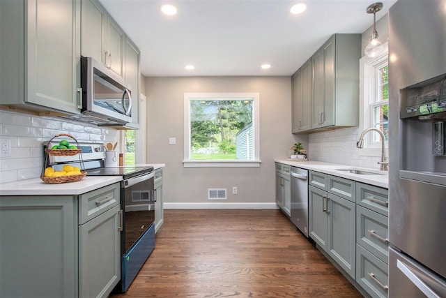 424 S Cass St, Berrien Springs, MI 49103 - kitchen with stainless steel appliances, gray cabinetry, a sink, baseboards, and recessed lighting