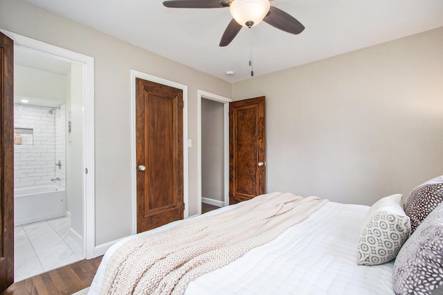 424 S Cass St, Berrien Springs, MI 49103 - bedroom with baseboards, ensuite bath, and ceiling fan