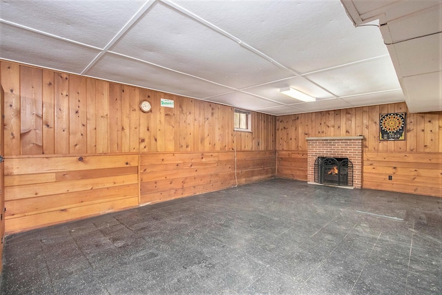 424 S Cass St, Berrien Springs, MI 49103 - basement with wooden walls, a brick fireplace, and tile patterned floors