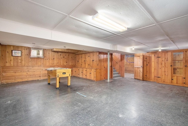 424 S Cass St, Berrien Springs, MI 49103 - basement featuring tile patterned floors, wood walls, and stairway