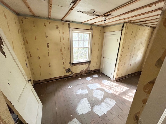 2317 Flushing Rd, Flint, MI 48504 - unfurnished bedroom featuring light wood-type flooring