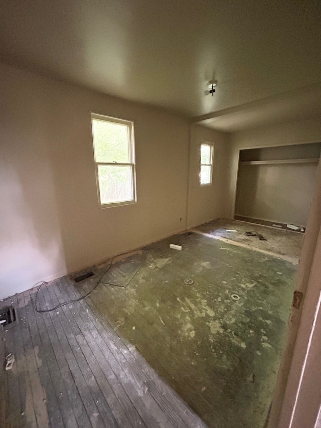 2317 Flushing Rd, Flint, MI 48504 - unfurnished bedroom featuring hardwood / wood-style floors