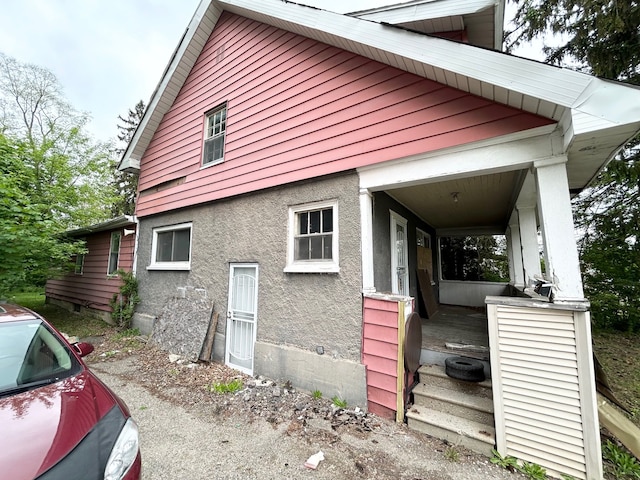 2317 Flushing Rd, Flint, MI 48504 - view of property exterior featuring covered porch