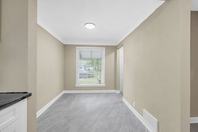 9583 Stahelin Ave, Detroit, MI 48228 - unfurnished room with baseboards and a textured wall