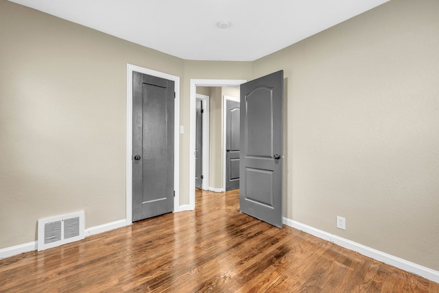 9583 Stahelin Ave, Detroit, MI 48228 - unfurnished bedroom featuring baseboards and wood finished floors