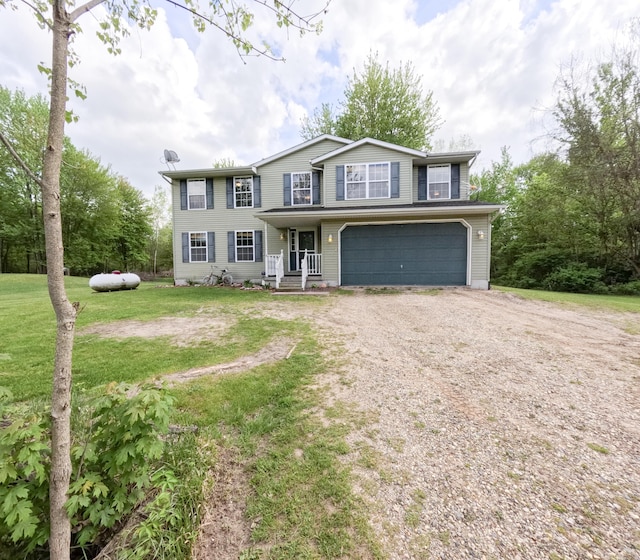 5734 108th Ave, Pullman, MI 49450 - view of front of home featuring driveway, an attached garage, and a front lawn