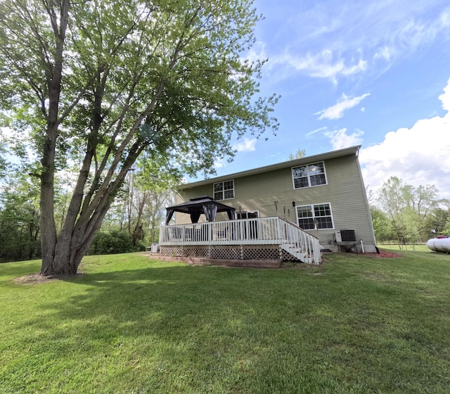 5734 108th Ave, Pullman, MI 49450 - rear view of house with a deck, a yard, and cooling unit