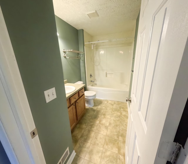 5734 108th Ave, Pullman, MI 49450 - full bath featuring toilet, a textured ceiling, vanity, and shower / washtub combination