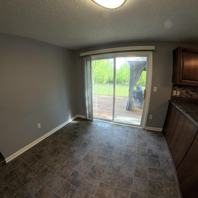 5734 108th Ave, Pullman, MI 49450 - empty room featuring a textured ceiling and baseboards