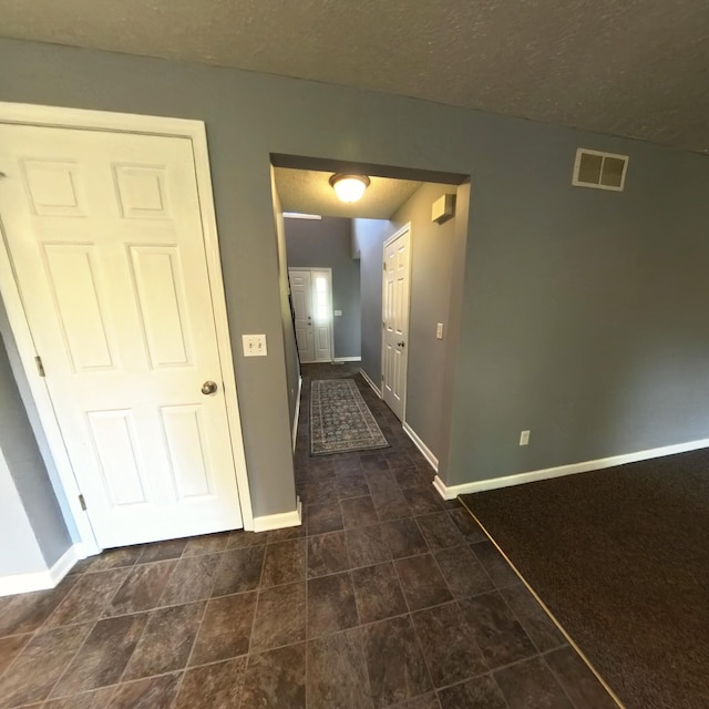 5734 108th Ave, Pullman, MI 49450 - corridor featuring baseboards and a textured ceiling