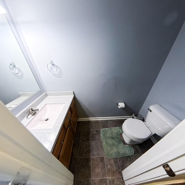 5734 108th Ave, Pullman, MI 49450 - half bathroom with toilet, vanity, baseboards, and tile patterned floors