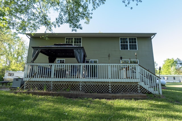 5734 108th Ave, Pullman, MI 49450 - rear view of property featuring a lawn and a deck