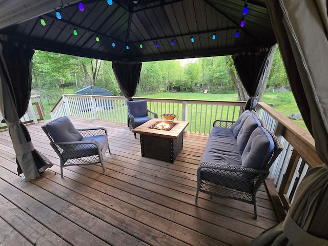 5734 108th Ave, Pullman, MI 49450 - wooden terrace with a gazebo, a lawn, a storage unit, and an outdoor living space with a fire pit
