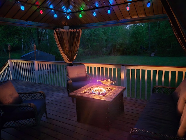 5734 108th Ave, Pullman, MI 49450 - deck featuring an outdoor fire pit, a yard, an outbuilding, and a gazebo
