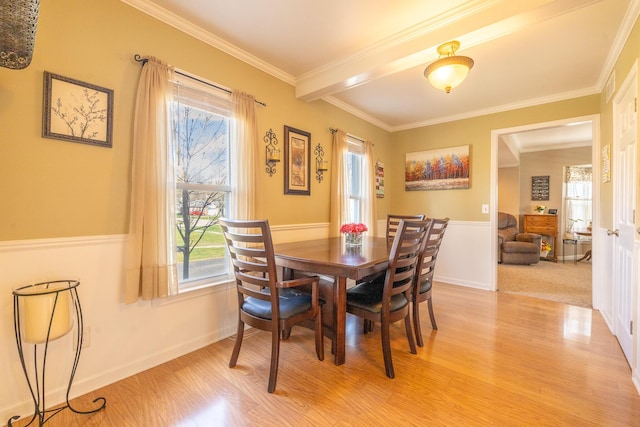 1719 Center St, Carleton, MI 48117 - dining room featuring light wood finished floors, ornamental molding, and wainscoting