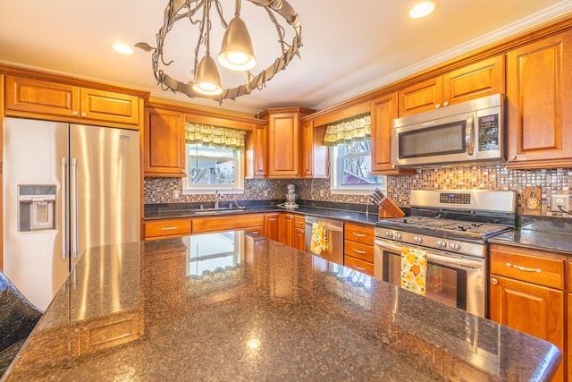 1719 Center St, Carleton, MI 48117 - kitchen featuring appliances with stainless steel finishes, brown cabinetry, recessed lighting, and ornamental molding