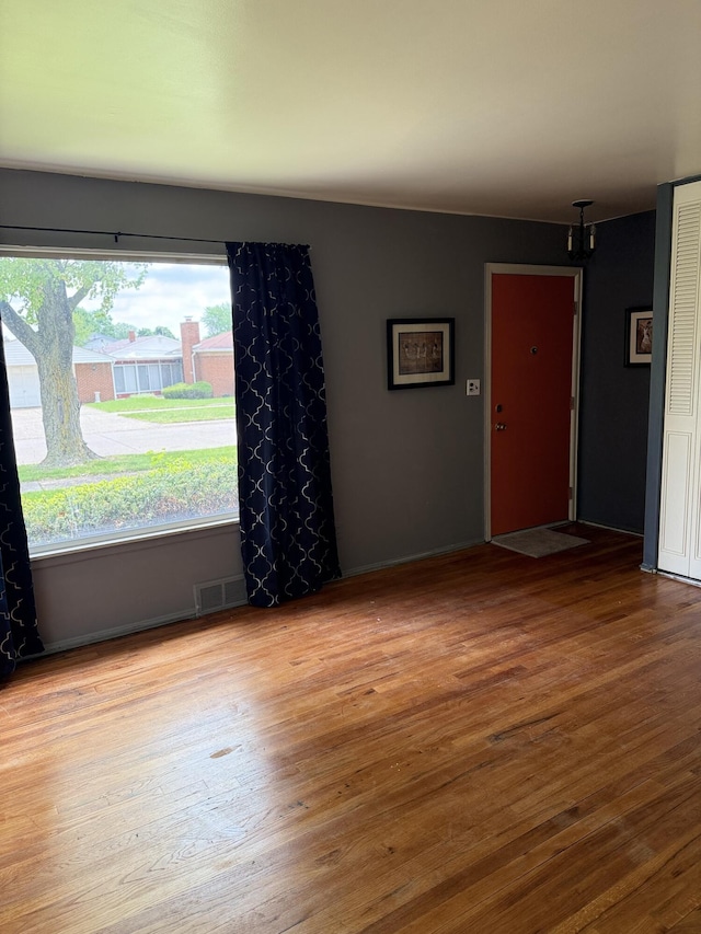 unfurnished room featuring wood finished floors