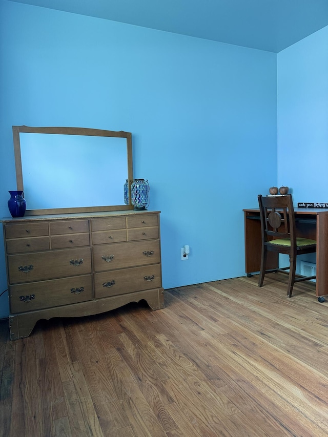 bedroom with dark wood-style floors