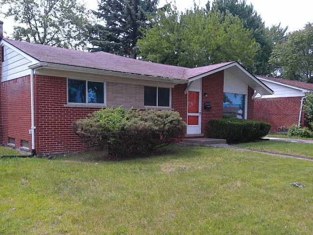 21423 Scotia Ln, Ferndale, MI 48220 - single story home with brick siding, a front lawn, and a chimney