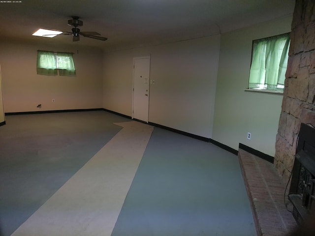 21423 Scotia Ln, Ferndale, MI 48220 - spare room featuring a ceiling fan, healthy amount of natural light, concrete floors, and baseboards