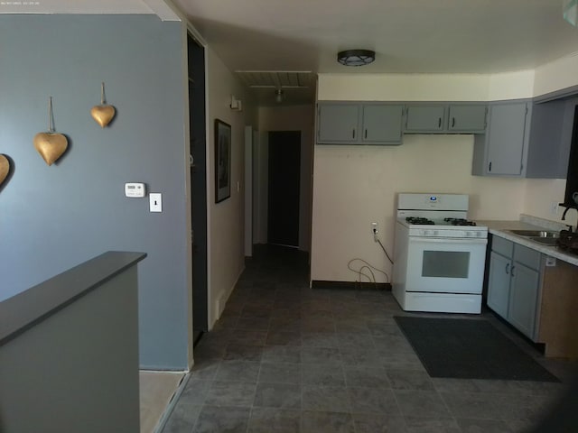 21423 Scotia Ln, Ferndale, MI 48220 - kitchen with gas range gas stove, a sink, gray cabinets, and light countertops