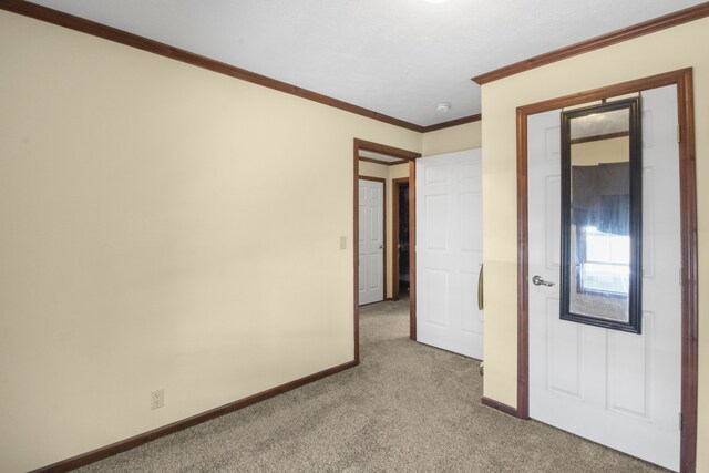 29878 Meadow Ln, Gibraltar, MI 48173 - unfurnished bedroom with carpet floors, baseboards, and crown molding