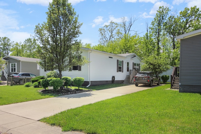 29878 Meadow Ln, Gibraltar, MI 48173 - view of front of home with a front yard and driveway