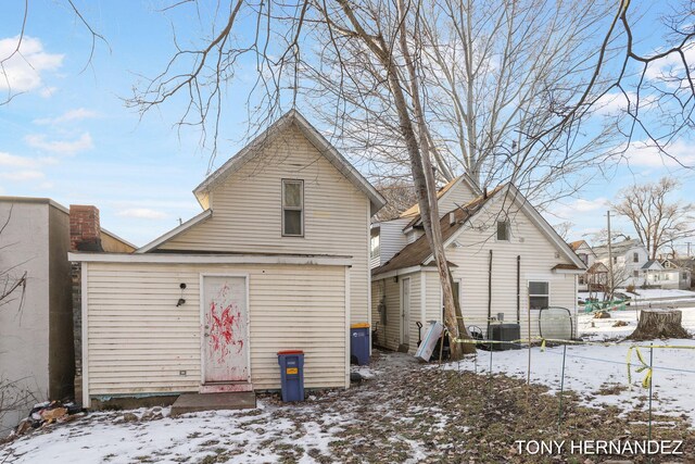 1402 N Ave NE, Grand Rapids, MI 49505 - snow covered property featuring cooling unit