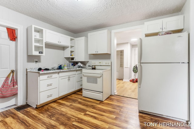 1402 N Ave NE, Grand Rapids, MI 49505 - kitchen with white appliances, dark wood-style floors, white cabinetry, open shelves, and a textured ceiling